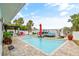 Inviting pool and patio overlooking the water at 5690 Bayview Dr, Seminole, FL 33772