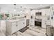 Bright kitchen featuring a large island and stainless steel appliances at 5690 Bayview Dr, Seminole, FL 33772
