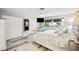Spacious primary bedroom with plush carpet, large windows, and ample closet space at 5690 Bayview Dr, Seminole, FL 33772