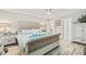 Main bedroom with a neutral color scheme, king-size bed, and built-in shelving at 5690 Bayview Dr, Seminole, FL 33772
