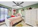 Bright bedroom with a double bed, large closet, and window coverings at 5690 Bayview Dr, Seminole, FL 33772
