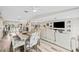 Open concept living room and dining area with hardwood floors at 5690 Bayview Dr, Seminole, FL 33772