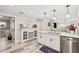 Spacious kitchen with white cabinets, island, and stainless steel appliances at 5690 Bayview Dr, Seminole, FL 33772