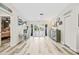 Bright and spacious entryway with double doors leading outside at 5690 Bayview Dr, Seminole, FL 33772