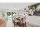 Dining room with a large table and chairs, and pool access at 5690 Bayview Dr, Seminole, FL 33772
