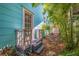 Steps leading to the backyard with tropical plants at 407 10Th Ne Ave, St Petersburg, FL 33701