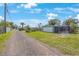 Home exterior view, showcasing the front yard and driveway at 751 90Th N Ave, St Petersburg, FL 33702