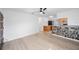 Bright living room with stone accent wall and laminate flooring at 751 90Th N Ave, St Petersburg, FL 33702