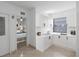 Modern kitchen with white cabinets and breakfast bar at 751 90Th N Ave, St Petersburg, FL 33702