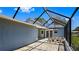 Covered patio with seating area and access to the backyard at 751 90Th N Ave, St Petersburg, FL 33702