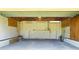 Empty garage with concrete floor and overhead door at 751 90Th N Ave, St Petersburg, FL 33702