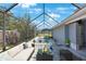Relaxing pool area with covered patio and seating at 751 90Th N Ave, St Petersburg, FL 33702
