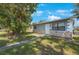 Ranch style home with stone accents and a landscaped yard at 751 90Th N Ave, St Petersburg, FL 33702
