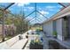 Relaxing pool area with covered patio and seating at 751 90Th N Ave, St Petersburg, FL 33702