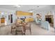 Kitchen with light wood cabinets and dining area at 751 90Th N Ave, St Petersburg, FL 33702