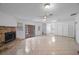 Spacious living room featuring a fireplace and tile floors at 751 90Th N Ave, St Petersburg, FL 33702