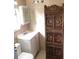 Bathroom with toilet and sink, decorative screen at 751 90Th N Ave, St Petersburg, FL 33702