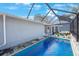 Inviting swimming pool with a screened enclosure at 751 90Th N Ave, St Petersburg, FL 33702