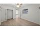 Spacious bedroom with wood flooring and a large window at 751 90Th N Ave, St Petersburg, FL 33702