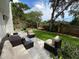 A lovely backyard with a patio, furniture, grill, and hammock for relaxation at 1503 Edna Ave Nw, Largo, FL 33770
