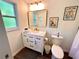 Updated bathroom featuring modern vanity, contemporary fixtures, and stylish mirror at 1503 Edna Ave Nw, Largo, FL 33770