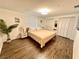 Cozy bedroom with a comfortable bed, neutral decor, and ample closet space at 1503 Edna Ave Nw, Largo, FL 33770