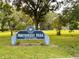 Charming Northwest Park entrance with playground area, picnic benches and lush green scenery at 1503 Edna Ave Nw, Largo, FL 33770