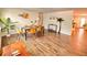 Bright dining room featuring stylish decor, modern furniture, and beautiful wood-look tile flooring at 1503 Edna Ave Nw, Largo, FL 33770
