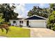 Beautiful single-story home with a well-kept lawn and a two-car garage, perfect for curb appeal at 1503 Edna Ave Nw, Largo, FL 33770