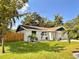 A charming home with a fenced yard and beautiful landscaping at 1503 Edna Ave Nw, Largo, FL 33770
