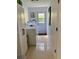 Functional laundry room featuring washer, dryer, ample storage, and convenient access to the outside at 1503 Edna Ave Nw, Largo, FL 33770