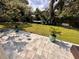 Outdoor patio has pavers, landscaping, and a hammock in the backyard at 1503 Edna Ave Nw, Largo, FL 33770