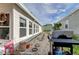Backyard with grill, stone pathway, and mature plants at 192 Blue Marlin Dr, Oldsmar, FL 34677