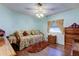 Cozy bedroom with daybed, wooden dresser and a brown rug at 192 Blue Marlin Dr, Oldsmar, FL 34677