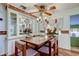 Charming dining room with glass-top table and wood chairs at 192 Blue Marlin Dr, Oldsmar, FL 34677