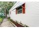 Exterior view showcasing a well-maintained home with red shutters at 192 Blue Marlin Dr, Oldsmar, FL 34677