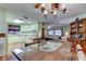 Cozy kitchen with light cabinets, wood flooring, and a dining table at 192 Blue Marlin Dr, Oldsmar, FL 34677