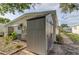Gray storage shed located in the backyard, next to AC unit at 192 Blue Marlin Dr, Oldsmar, FL 34677