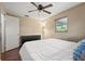 Spacious bedroom with a double bed, ceiling fan, and ample closet space at 2036 Forest Dr, Clearwater, FL 33763