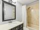 Clean bathroom with a tub, shower, and updated vanity at 5985 91St N Ave, Pinellas Park, FL 33782