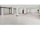 Spacious garage with epoxy flooring and high ceilings at 5966 Bayview S Cir, St Petersburg, FL 33707