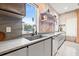 Modern kitchen with sink, custom cabinetry and a view at 5966 Bayview S Cir, St Petersburg, FL 33707