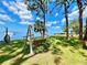 Relaxing waterfront view with a park bench swing at 2700 Bayshore Blvd # 3212, Dunedin, FL 34698
