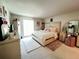 Main bedroom with a king-size bed and dressing table at 2700 Bayshore Blvd # 3212, Dunedin, FL 34698