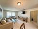 Living room with sofa, dining table and access to kitchen at 2700 Bayshore Blvd # 3212, Dunedin, FL 34698