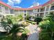 Community courtyard with lush landscaping and a central fountain at 2700 Bayshore Blvd # 3212, Dunedin, FL 34698