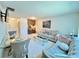 Living room with sofa, dining area, and kitchen bar at 2700 Bayshore Blvd # 3212, Dunedin, FL 34698