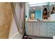 Bathroom with a bathtub, vanity, and decorative shower curtain at 192 Blue Marlin Dr, Oldsmar, FL 34677
