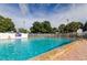Inviting community pool with ample deck space for sunbathing and relaxation at 192 Blue Marlin Dr, Oldsmar, FL 34677