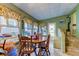 Charming dining area with wood table and chairs near the back door at 192 Blue Marlin Dr, Oldsmar, FL 34677